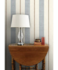 Fresh Printed Modern Striped Vinyl Wallcovering Featuring Subtle Leather Texture Ultra Durable Pastable Wallcover on a wall with a lamp.