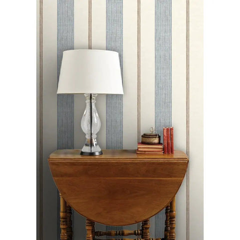 Fresh Printed Modern Striped Vinyl Wallcovering Featuring Subtle Leather Texture Ultra Durable Pastable Wallcover on a wall with a lamp.