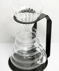 Kick Your Morning Routine Upstairs With This Rock Solid Iron Brew Station Perfect For Home Baristas Seeking Consistent Heat And A Go To Pour Over Setup Always On Point - glass dripper above clear carafe with metal stand.