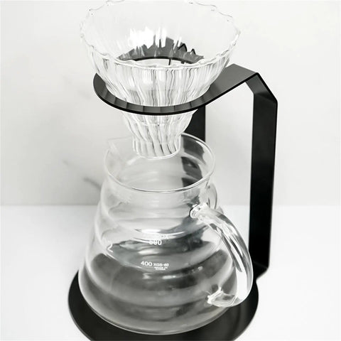 Kick Your Morning Routine Upstairs With This Rock Solid Iron Brew Station Perfect For Home Baristas Seeking Consistent Heat And A Go To Pour Over Setup Always On Point - glass dripper above clear carafe with metal stand.