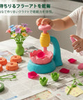 Kids DIY Craft Kit For Creative Imagination And Personal Art Projects At Home Fun Reusable Paper Materials That Inspire Creative Expression Through Hands On Crafting And Colorful Family Friendly Fun. child using paper flower maker kit on table