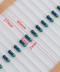 Close-up of 1460-Piece 1/4W 73-Value 1% Metal Film Resistor Kit for Arduino Projects showing resistor size and dimensions.