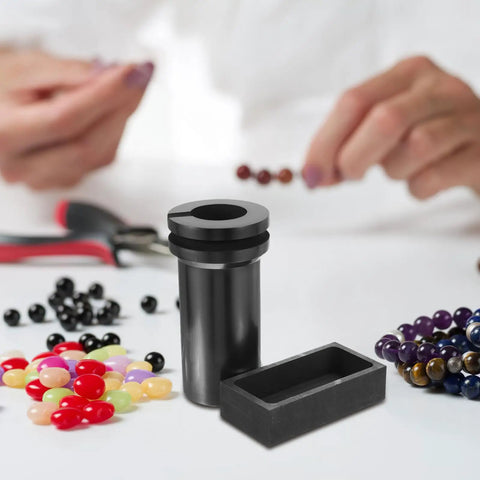 Heavy Lifter Graphite Crucible And Metal Smelting Mold Set With Integrated Oil Traps, black graphite crucible shown with colorful beads.