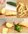 Crinkle cutter with stainless steel blades slicing potatoes into wavy fries on a wooden board.