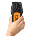Hand holding a compact Kickass Dead Accurate Stud Finder And Wall Scanner detecting wood and metal behind drywall.