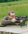Person using Adjustable Ambidextrous Rifle And Shotgun Shooting Rest For Outdoors And Range With Rock Solid Steel Frame Full Windage