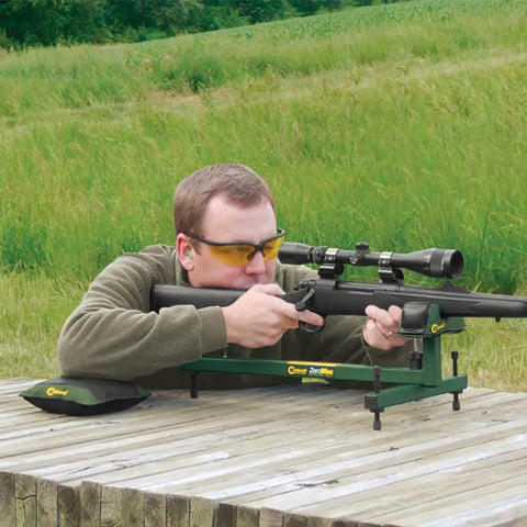 Person using Adjustable Ambidextrous Rifle And Shotgun Shooting Rest For Outdoors And Range With Rock Solid Steel Frame Full Windage