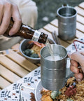 Pouring drink into Stainless Steel Water Cup 350ml Multi Function Camping Mug With Smooth Edges Design Silver For Outdoor Adventures