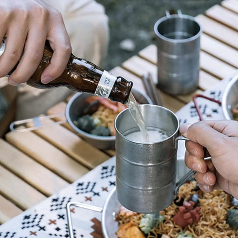 Pouring drink into Stainless Steel Water Cup 350ml Multi Function Camping Mug With Smooth Edges Design Silver For Outdoor Adventures