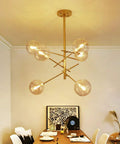 Modern Glass Pendant Lights Matte Gold Finish Six Or Eight Bulb Ceiling Fixtures Smooth Fit Install in dining room setting.