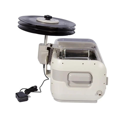 Score Crystal Clear Sound Back With This Digital Pro Vinyl Record Cleaner showing stainless steel cleaner with LPs.