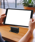No Sweat Under Desk Laptop Bracket With Adjustable Angle Holder For Keyboard And Router Storage Black Plastic Build, shown in hands on desk.
