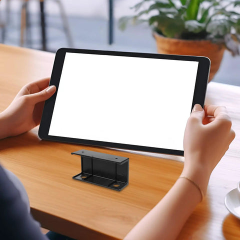 No Sweat Under Desk Laptop Bracket With Adjustable Angle Holder For Keyboard And Router Storage Black Plastic Build, shown in hands on desk.