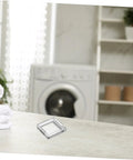 26mm Button Protector Cover With Double Sided Adhesive Waterproof Plastic Power Switch Guard on counter near washer