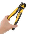Kickass Heavy Duty Auto Wire Stripper And Crimping Pliers Pro Gear For Electricians Rapid Line Stripping Multi Function Cable Cutter Tool With Rugged Yellow Grip held in hand.