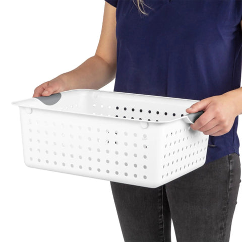 Person holding Large Ultra Storage Baskets Pack Of 6 For Closet, Cabinet, And Pantry Organization, White Bins With Contoured Handles