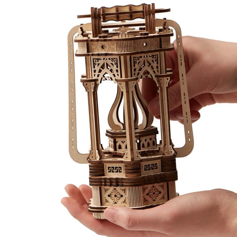 Hands holding Dope Wooden Puzzle Lantern With LED Light for Adults and Teens, DIY assembly, 145 pieces, eco-friendly wood