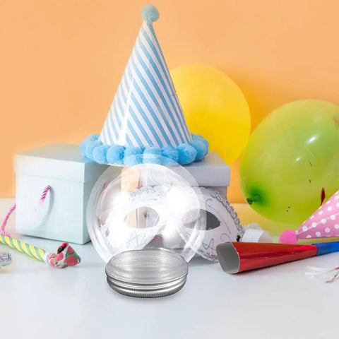 DIY Snow Globe Kit With Ten Clear Plastic Water Globes And Screw Off Caps For Easy Fillable Keepsakes displayed among party decor