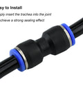 Close-up of black PU4 tube fitting with blue O-rings and metal collars on a 4 mm PTFE tube