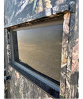 Close-up of the window on the Kick Ass Solid 6X8 Wooden Deer Blind Featuring Hella Warm R6 Insulation Panels.