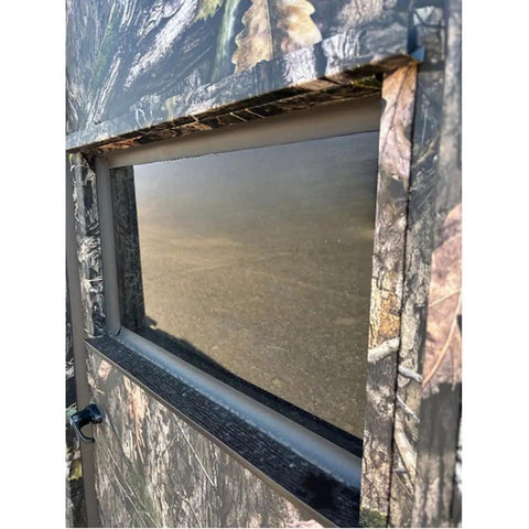 Close-up of the window on the Kick Ass Solid 6X8 Wooden Deer Blind Featuring Hella Warm R6 Insulation Panels.