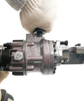 Close-up of Cordless Rebar Cutter RC16B Portable Construction Tool in use, showing cutting mechanism for 4mm to 16mm rebar.