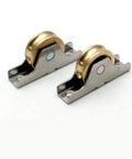 Four Piece V Groove Sliding Door Rollers With Antique Copper Finish Heavy Duty Cabinet Pulleys Featuring Precision Bearings Close-up of two roller components.