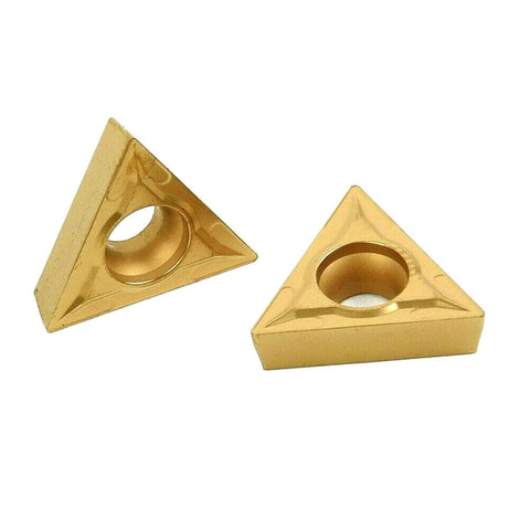 Two gold triangular carbide inserts (TCMT style) with central mounting holes for external turning tools.