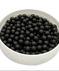 Close-up of Plant Based Pigeon Health Tablets For Palomas Breeding And Recovery Safe Herbal Pills 300 And 600 Count in a dish.