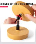 Hands holding Eraser Wheel for Drill Decal Remover with adapter, showing installation process, close-up view.
