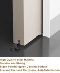 Image showing Four Pack Black T Shape Barn Door Floor Guides for Sliding Doors Bottom Track Hardware installed on barn door.