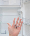 Hand holding Heavy Duty Aluminum Refrigerator Shelf Clips and Freezer Shelf Hooks for home and commercial use, silver finish.