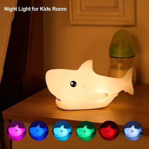Rechargeable Cute Squishy Shark Night Light For Kids And Teens Soft Silicone Touch Lamp With Gentle Glow on bedside table