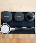 Top view of Espresso Tamping Mat With Portafilter Dock, Food Grade Silicone Coffee Tamper Mat For Baristas on countertop
