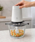 Cuisine Talent Electric Food Chopper With 1.8L Glass Bowl 150W Motor in use chopping mixed veggies.