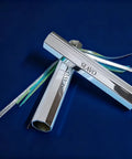 Two Pack Reflective Spearfishing Throw Flashers With Dual Tails For Trolling And Deep Drop, silver finish on a blue background