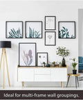 Living room wall with wood frames hung using Heavy Duty Picture Hanging Kit For Wood Frames And Canvases On Drywall, gallery setup