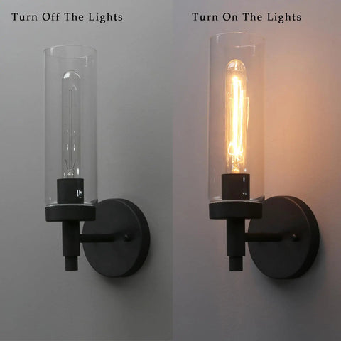 Matte Black Rustic Industrial Wall Sconce Light With Tubular Clear Glass Lampshade shown off and on, wall-mounted