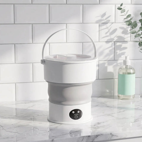 Sweet Compact Folding Mini Washing Machine Portable Travel Washer For Socks Underwear And Delicates Quick Rinse Auto Drain Straight Up Compact Design For Dorms on a marble counter.