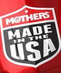 Red product label 'Mothers Made in the USA' on car surface, relates to CMX Ceramic Spray Coating For Cars 24 Oz Easy To Apply Pro Grade.