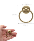 Hand holding 5 Pack Gold Ring Drawer Pulls With Screws, Brass Cabinet Handles Drop Knobs, showing size and design.