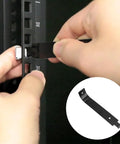 Using Smooth Operator Cage Nut Remover Tool For Car Door Rack And Cabinet Pry Plate Disassembly 10 Cm Black on a metal rail.