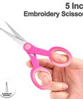 5 Inch Embroidery Scissors, pink slanted-tip stainless steel, held in hand for thread trimming