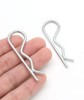 20 Pack R Clips Hitch Pins For Trailers Stainless Steel M3 By 60mm Retaining Cotter Pins, close-up showing hand holding clips