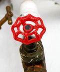 Close-up of a red metal valve handwheel from Red Metal Valve Handwheel Replacement Set 5 Pcs For Gate Valves And Faucet Handles 6x6 cm