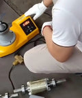 Heavy Duty Industrial Tower Cone Bearing Heater At 220 Volt With Automatic Demagnetization setup being used with metal parts.