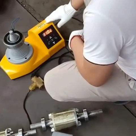 Heavy Duty Industrial Tower Cone Bearing Heater At 220 Volt With Automatic Demagnetization setup being used with metal parts.