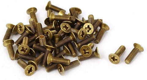 Heavy Duty Brass Fasteners Featuring Flat Countersunk Phillips Heads Top Shelf Self Tapping Machine Screws in a pile.