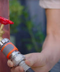 Person connecting Premium Metal Quick Connect Hose Fittings Set For Five Eighths Or Half Inch Hoses No Kink Easy Watertight Quick Connect Kit