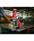 Milwaukee Style 1-5/8 Inch Auto Stop Electromagnetic Drill Kit with powerful 13 Amp motor in action on steel plate